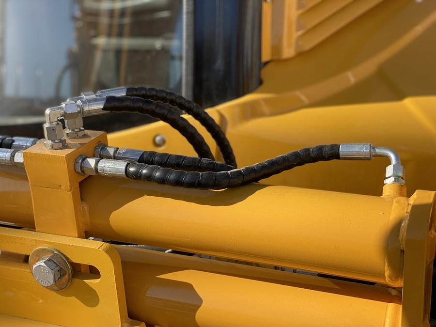 Hydraulic hoses on a machine, ready for repair