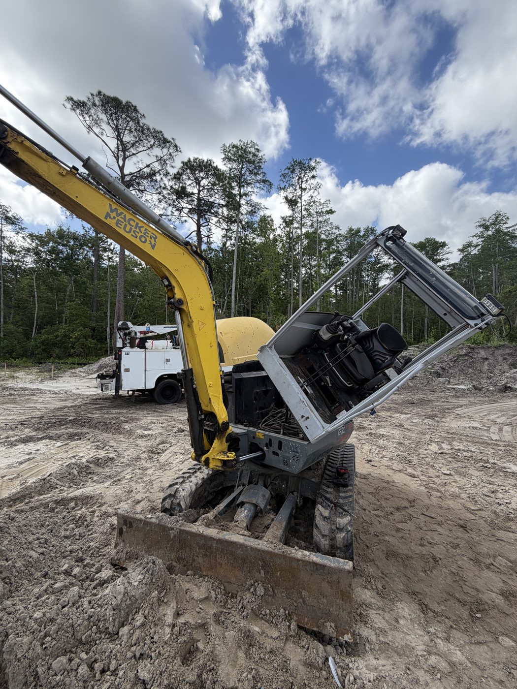 A mini excavator opened up for on-site repair