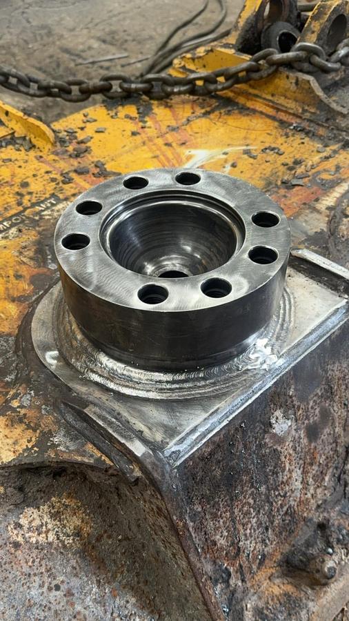 Steel part welded back onto a heavy machine